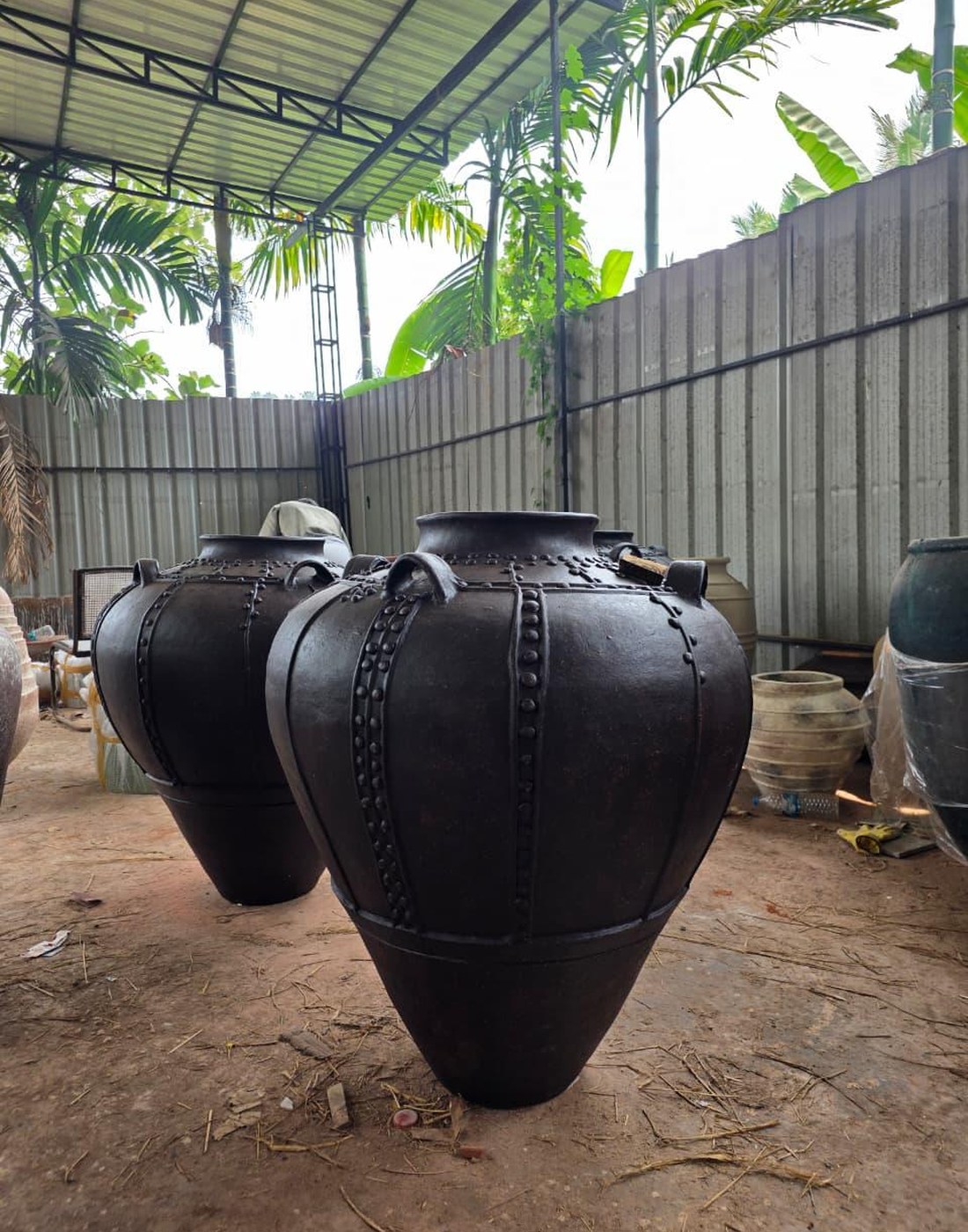 Large terracotta vessels in an artisan workshop
