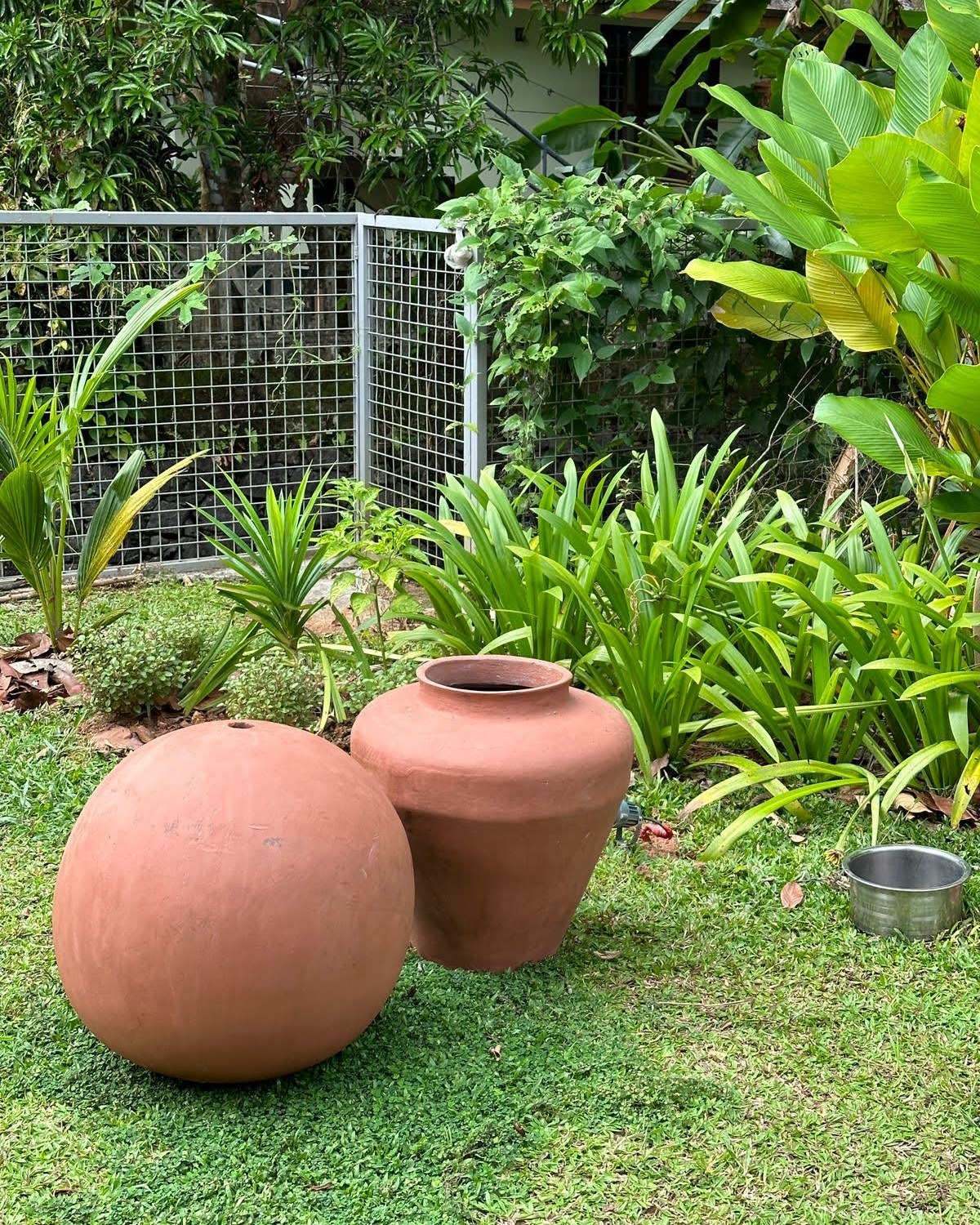 Terracotta decor used in an exterior garden setting